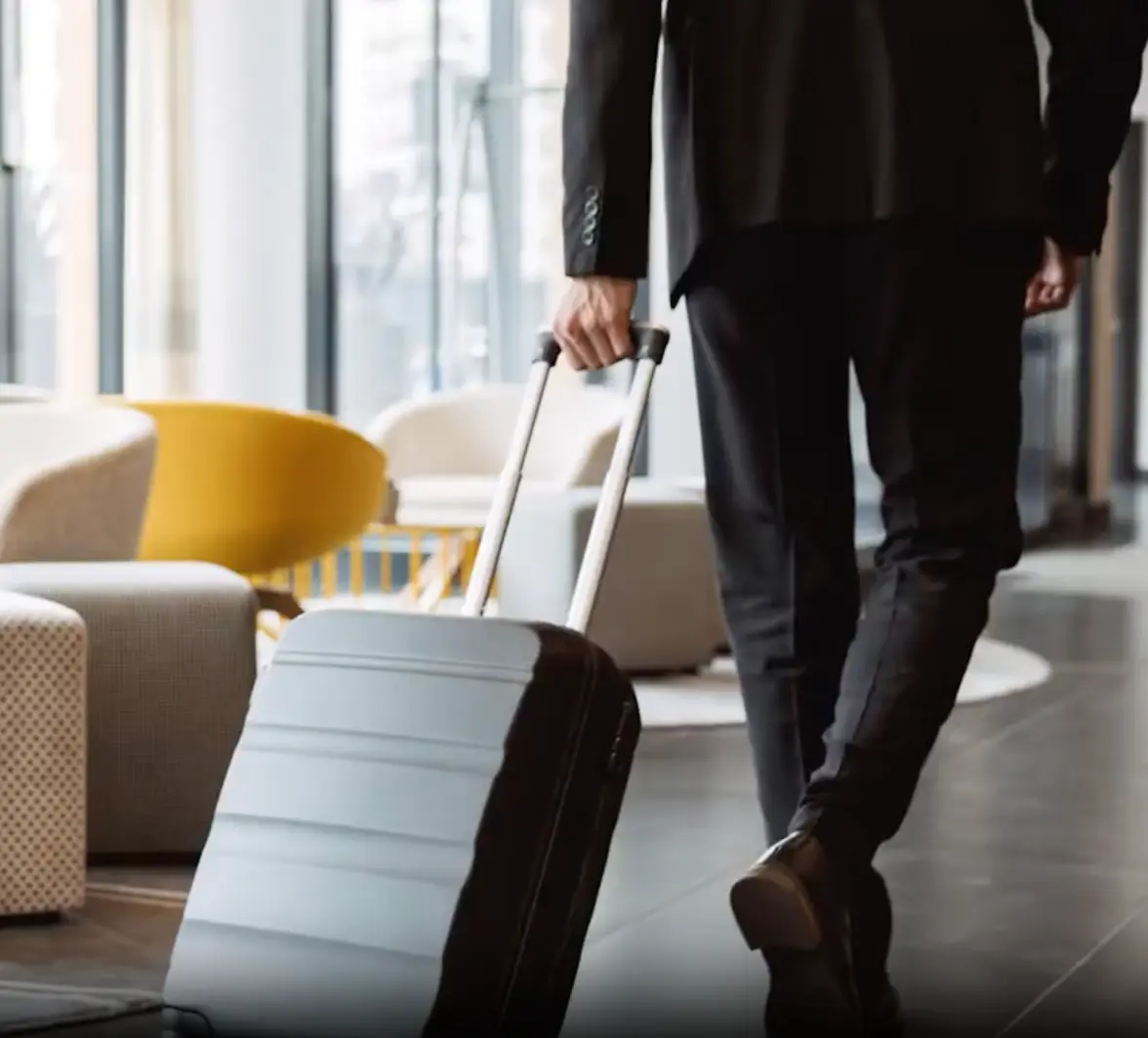 A man with a suitcase on an airport